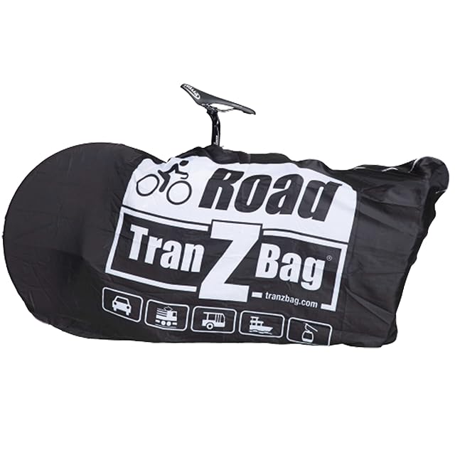 EVOC TranZbag ROAD packed into its own tiny stuff sack beside a road bike